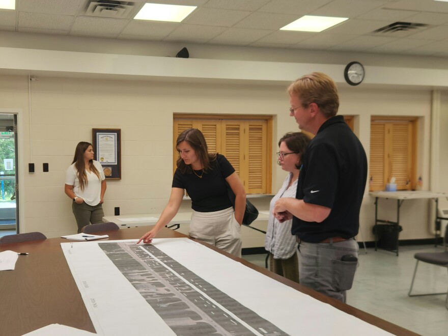 Alpena Transportation Service Center Manager Kevin Schaedig (right) speaks with Anne Gentry and Jessica Luther about a project to extend a bike path at the Charter Township of Alpena Office on Thursday, August 6, 2026.