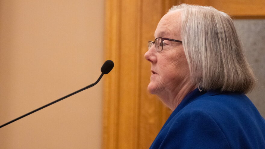 Laura Howard, secretary of the Kansas Department for Children and Families, says the state in 2025 improved services to more than 5,000 children in foster care. She says meaningful change takes time because no easy fixes exist for challenges in the system. In this image from June 10, 2025, Howard addresses a Kansas Senate committee regarding DCF's work with foster care contractors.