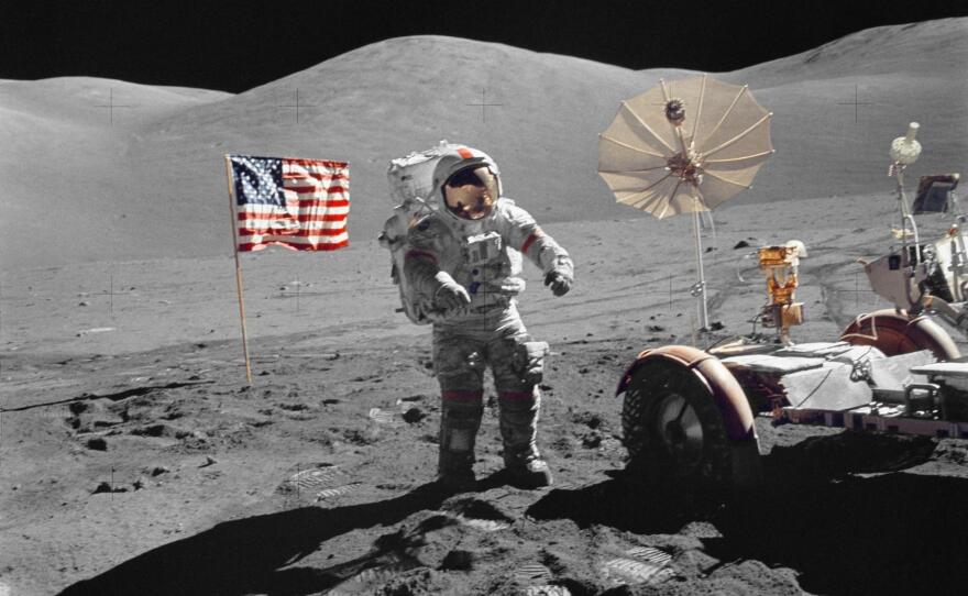 Astronaut Eugene A. Cernan, mission commander, walks toward the Lunar Roving Vehicle during NASA's sixth and final Apollo lunar landing mission in December 1972.
