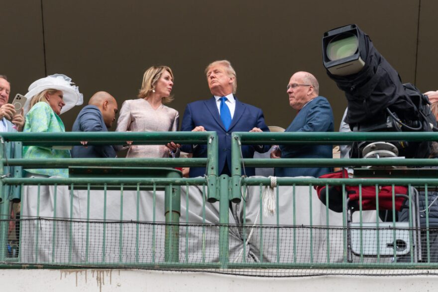  Donald Trump made an appearance at the 148th Kentucky Derby, flanked by former U.N. Ambassador Kelly Craft and Alliance Coal CEO Joe Craft.