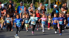 The kids take off from the starting line in Orlando in Track Shack's Seniors First Turkey Trot 5K fun run.