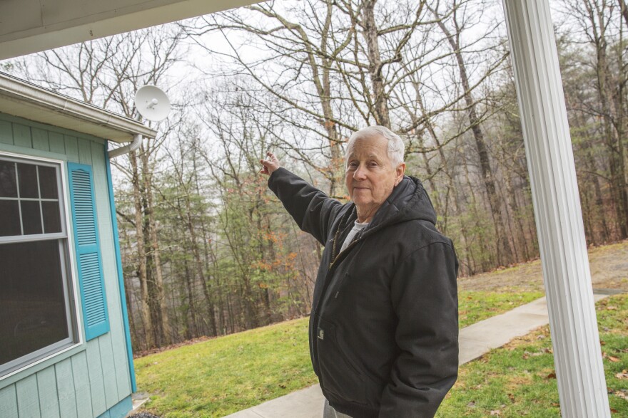 Ken Diven, a founding member of the cooperative and an early user of its service, points to the radio receiver at his home. It picks up signal from the radio tower and connects to a router inside.