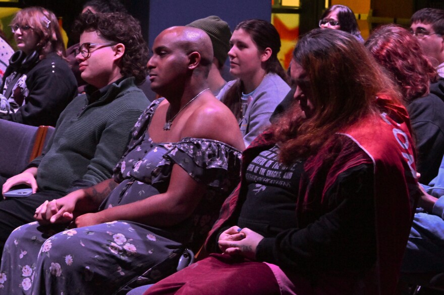 Levi Larouche, Jinx Leonard and Riley Richards listen to speakers at the Transgender Day of Remembrance at Wilkes University.
