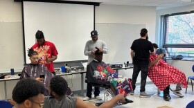 Barbers work with student customers at a pop-up Barbershop Talk event at Southern Connecticut State University April 14, 2026.