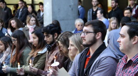 Steve Edney (left), 26, hospitality management major at Florida State University, with his friend Sean Edney (right) during the candlelight vigil at UF, honoring the victims of the Parkland shooting. (Samuel Figuera/WUFT News)
