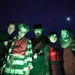 Five people dressed in spooky costumes.
