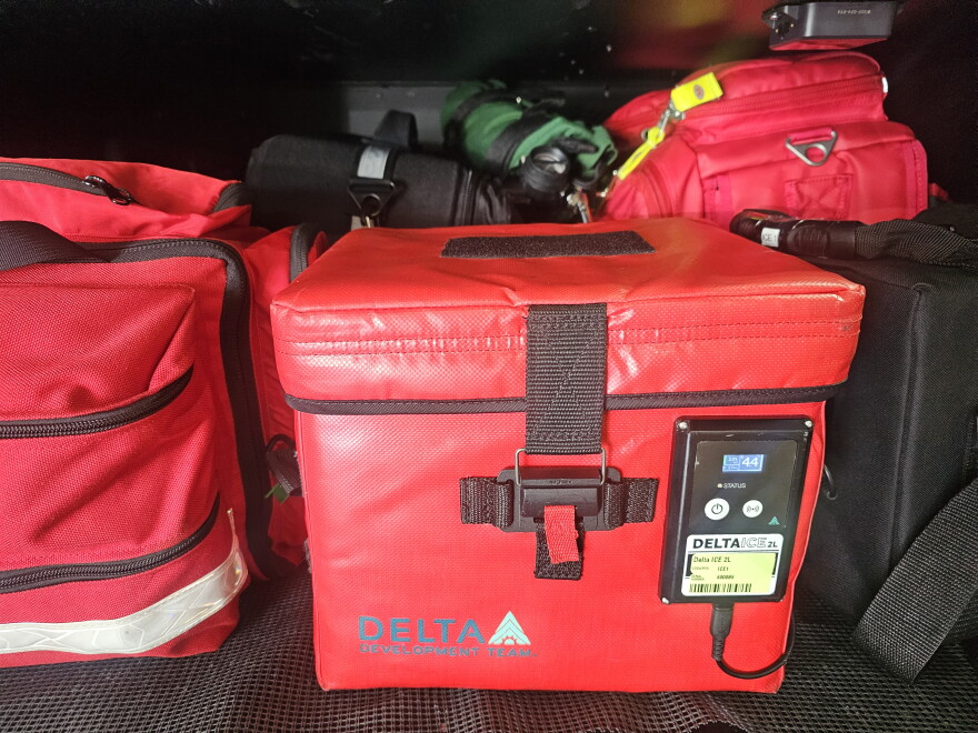 At the center of the system is a specialized cooler inside an insulated bag. Taney County uses a cooler measuring about 14 inches by 14 inches by 12 inches, with sensors that continuously monitor the temperature