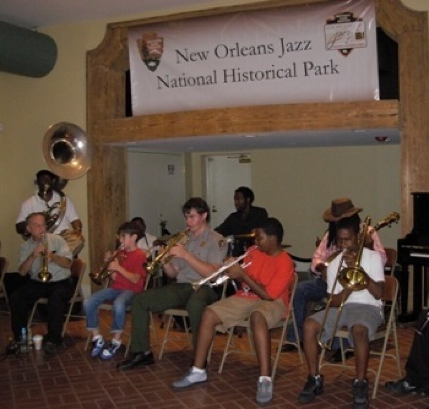 A group of locals both old and young perform together at the new Orleans Jazz National Historic Park.