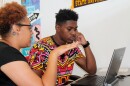 Danielle Washington of the Wyman Center walks Ozzie Furlow through financial aid literacy training at St. Louis Graduates' High School to College Center. Furlow plans to enroll as a freshman at Arkansas Baptist in August 2016.