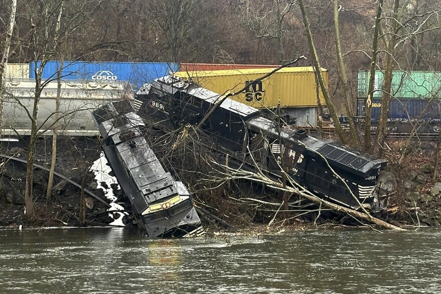 This photo provided by Nancy Run Fire Company shows a train derailment along a riverbank in Saucon Township, Pa., on Saturday, March 2, 2024.   Authorities said it was unclear how many cars were involved but no injuries or hazardous materials were reported.  