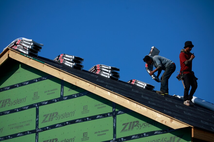 Contractors work on the roof of a house under construction in Louisville, Ky., on July 1. "America's fallen 3.8 million homes short of meeting housing needs," says Mike Kingsella, the CEO of research group Up for Growth, which on Thursday released a study about the problem of housing shortages. "And that's both rental housing and ownership."