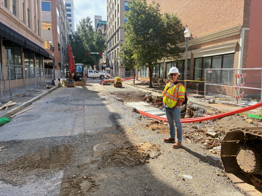 Civil engineer Marcus Aguilar stands in the construction zone for a stormwater project near First Street and Campbell Avenue.
