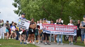 Pro-immigrant protesters line up to march in Fishers on Saturday, Aug. 1, 2026.