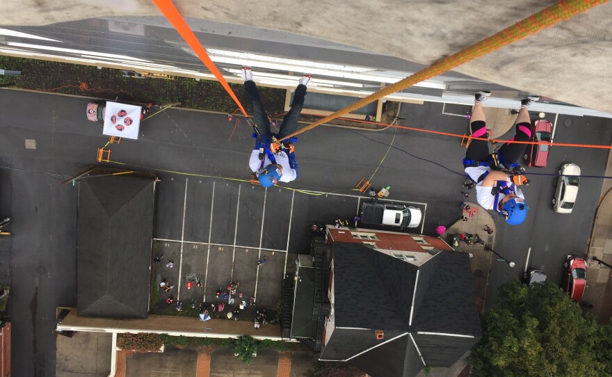 Participants rappel down the 12-story Fraser Center. 