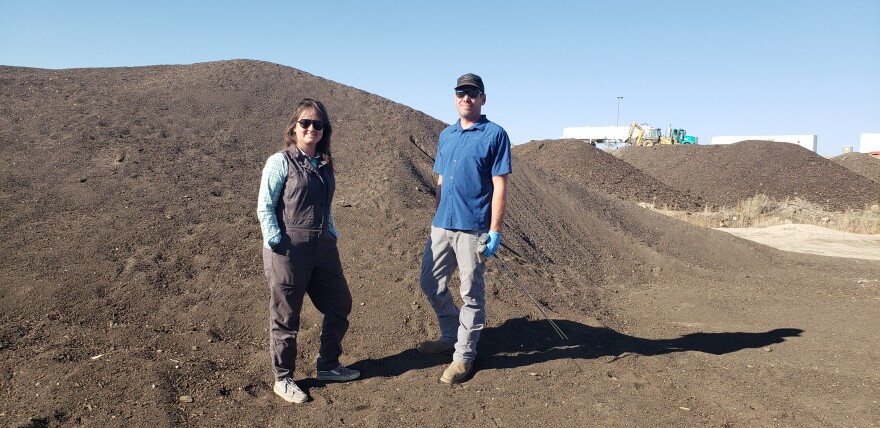 CHT Resources Co-founders Erica Sparhawk, CEO and Jake DeWolfe, COO stand near a finished compost pile at the company's Delta, County facility.