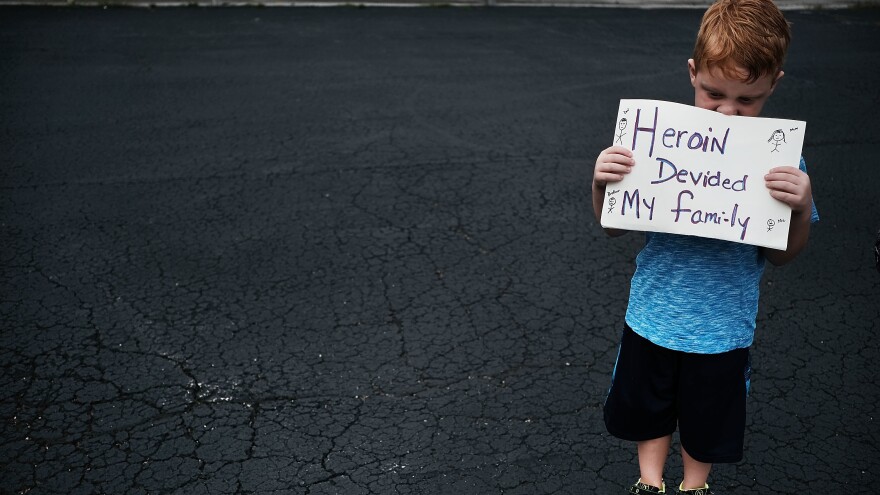 Derrick Slaughter attends a July 14, 2017, march through the streets of Norwalk, Ohio, against the epidemic of heroin, with his grandmother (not shown). Both of Derrick's parents are heroin addicts and he is now being raised by his grandparents.