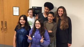 Aji Piper (top row, middle) Adonis Piper (second row, right) and attorney Andrea Rodgers (top row, right) at King County Superior Court, outside the courtroom where they won their case.