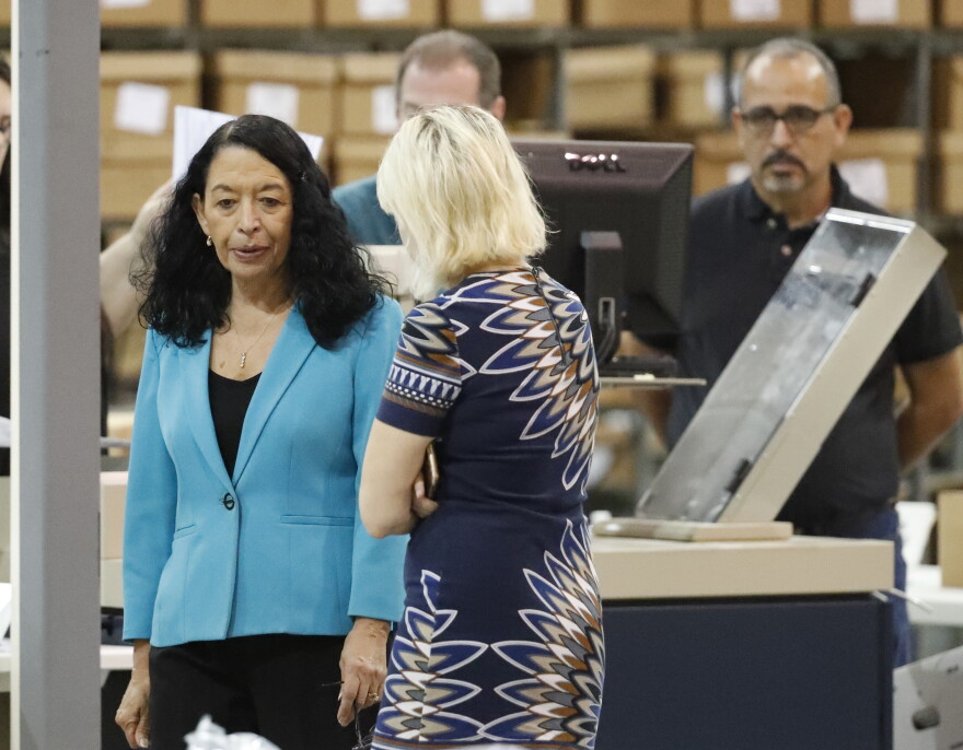 Palm Beach County Supervisor Of Elections Susan Bucher, left, speaks to employees before starting a recount at the Supervisor of Elections office, Thursday, Nov. 15, 2018, in West Palm Beach, Fla. 