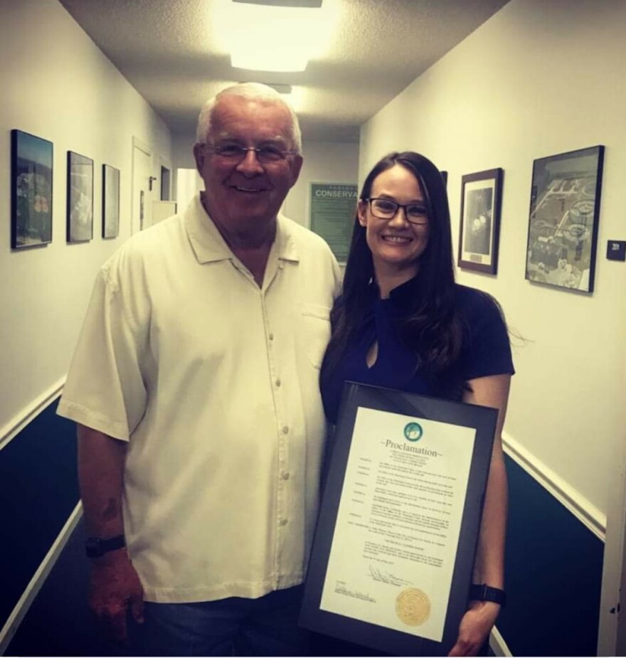 Mayor Mike Thomas (left) poses with Mary Jan Bossert (right) on May 10, 2019, during Municipal Clerks Week, six months before he allegedly berated her for providing a public record. 