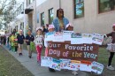 Brittany Mitchell leads her kindergarten class on a parade around their school as part of the Krewe of Morris Jeff.