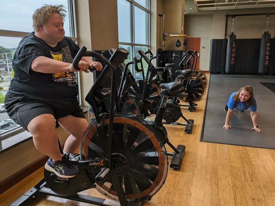 Jason Silverman, on the exercise bike, and his friend Melissa Mills go to the gym together when they hang out. The pair are part of the Friendship Project in Framingham, Massachusetts.