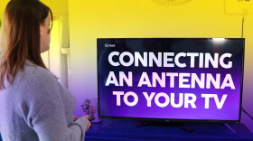 A TV with these words on the screen: Connecting an antenna to your TV
