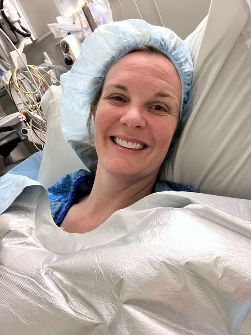 Hayley Harris lies in a hospital bed after her second ovary-removal surgery in December 2025. The procedure prompted her menopause symptoms, which she’s been treating with estrogen patches.
