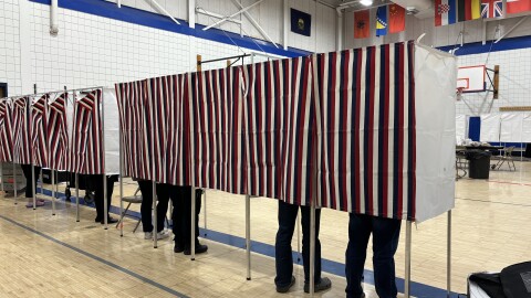 People fill voting booths for the presidential and state general election at Essex Middle School in Essex on Nov. 5, 2024.