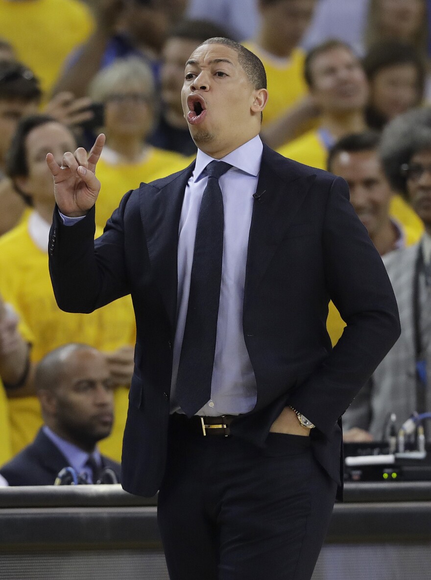 Cleveland Cavaliers head coach Tyronn Lue gestures during the first half of Game 1 of basketball's NBA Finals between the Golden State Warriors and the Cavaliers in Oakland, Calif.