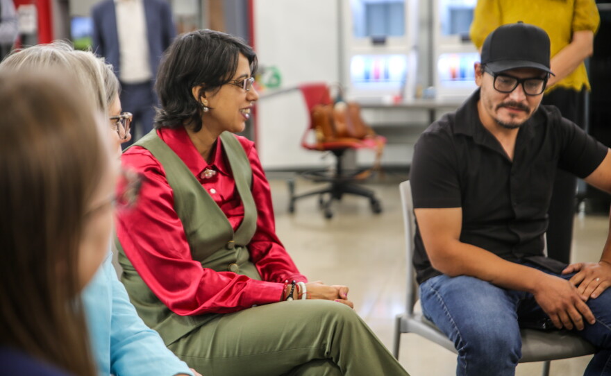 AWC President Dr. Reetika Dhawan and Automotive Technology instructor Luis Salas sit together during a student-faculty roundtable with Hobbs.