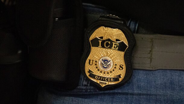 FILE - A federal agent wears an Immigration and Customs Enforcement badge in New York, June 10, 2025. (AP Photo/Yuki Iwamura, File)