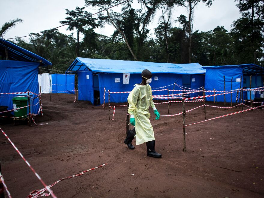 A health worker walks at an Ebola quarantine unit last June in Muma, Democratic Republic of the Congo, after a case of Ebola was confirmed in the village.