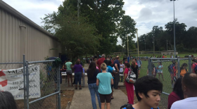 Buchholz High students get picked up by their parents from the Boys and Girls Club, which is near the school. The students were evacuated to the club following a bomb threat this morning. (Leah Marshall/WUFT News)