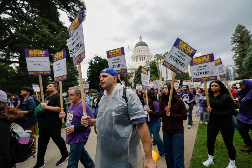 State workers represented by SEIU Local 1000 strike at the state Capitol in Sacramento on Oct. 21, 2026.