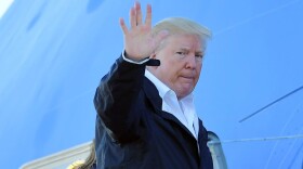 President Trump and first lady Melania Trump make their way to board Air Force One before departing from Andrews Air Force Base in Maryland en route to Puerto Rico on Oct. 3, 2017. (Mandel Ngan/AFP/Getty Images)