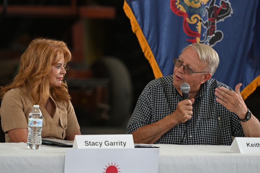 Republican candidate for Governor and state Treasurer Stacy Garrity speaks with Lackawanna County farmer Keith Eckel during a roundtable at his farm in Clarks Summit.