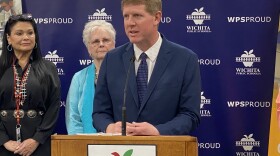 Kelly Bielefeld was named the Wichita school district's next superintendent. He joined board members (from left) Hazel Stabler and Sheril Logan at a press conference Friday.