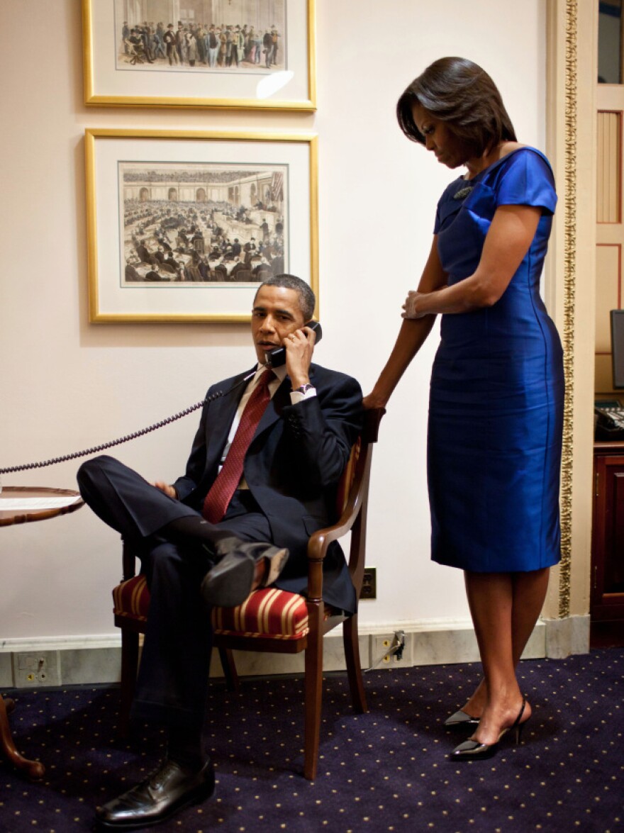 With first lady Michelle Obama looking on, President Obama speaks Tuesday with the father of Jessica Buchanan. She is the American aid worker who was rescued from Somali pirates after being held for three months.