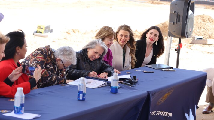 Governor Michelle Lujan Grisham signs HB99 into law.