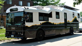 "Ripple," the Tallman Family's modified school bus, sits on the street corner in the neighborhood that saw it's transformation in Iowa City, Iowa on Tuesday, July 27, 2021.