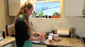 Amanda Moller prepares her formula in her home in University City, Missouri. The formula is vital to treat a rare condition, but her insurer doesn't cover it.