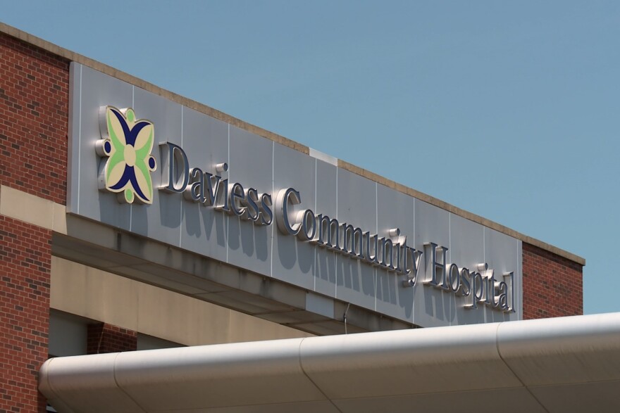 A sign on top of a building reads 'Daviess Community Hospital.'