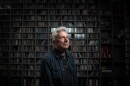 Joe Ely in the KUTX music library posing for a photo.