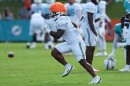 Former Miami Dolphins running back Anthony Hankerson does drills on a football field.