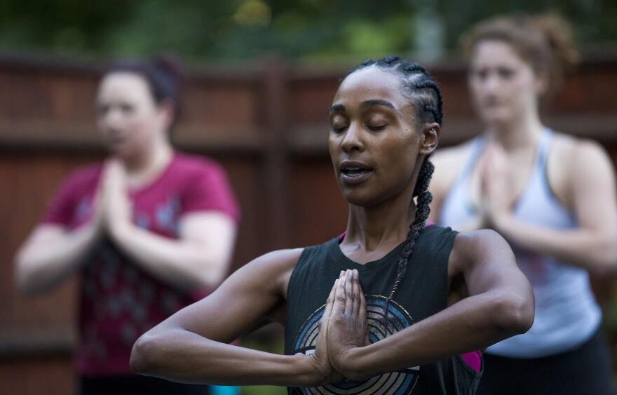 Kijana Rose directs her Beginners Ganja Yoga Flow students. 