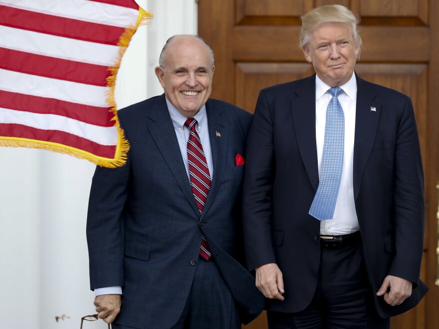 Rudy Giuliani is seen here with former President Trump in a photo from 2016. Federal authorities have raided Giuliani's apartment.