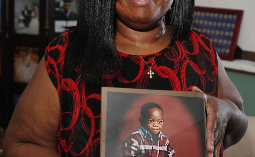 Sharletta Evans holds a photograph of her 3-year-old son Casson in Aurora, Colo., last July. Casson was killed in a drive-by shooting by two 15-year-olds.