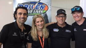 Dario Franchitti, Taylor McLean, Tim Clauson and Scott Dixon at an autograph event for Driven2SaveLives.