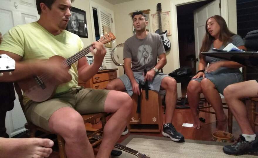 Angelo, Lucas and Laura Manzi, rehearsing with their family.