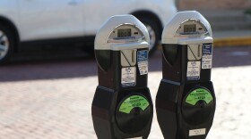 a close up of two City of Columbia parking meters. 